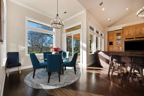 a kitchen with stainless steel appliances granite countertop a stove and cabinets