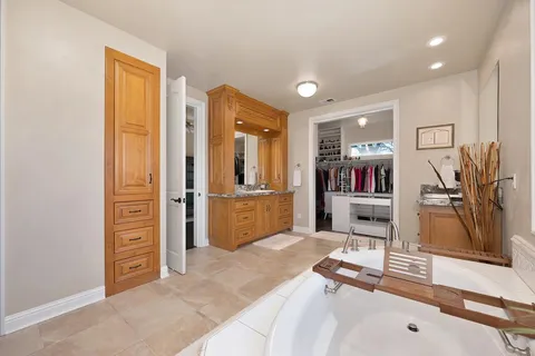 a view of a hallway with closet and entryway