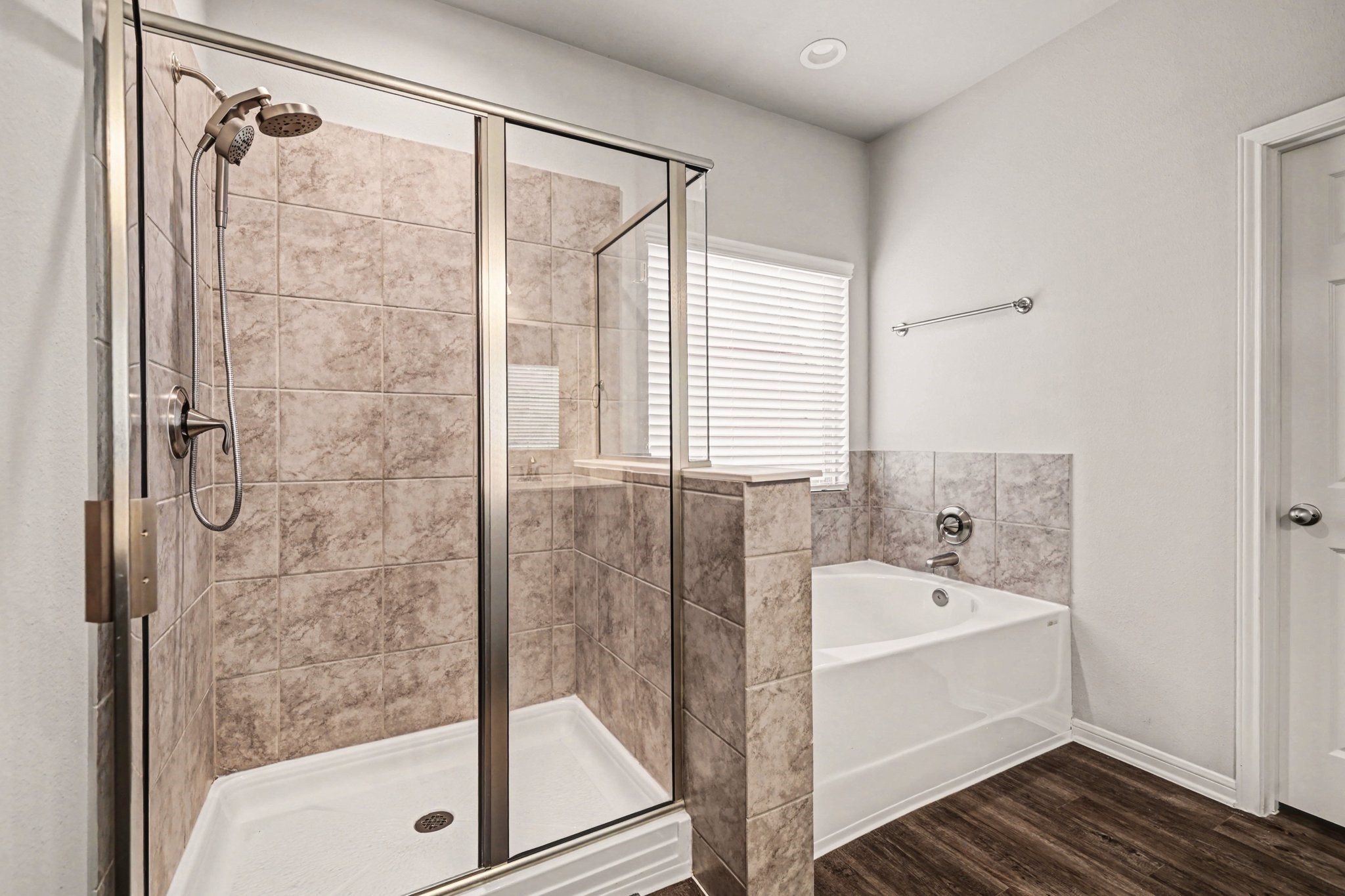 320 Red Maple Lane Conroe, TX 77304 - Photo 14 of 27 a bathroom with a bathtub and a shower