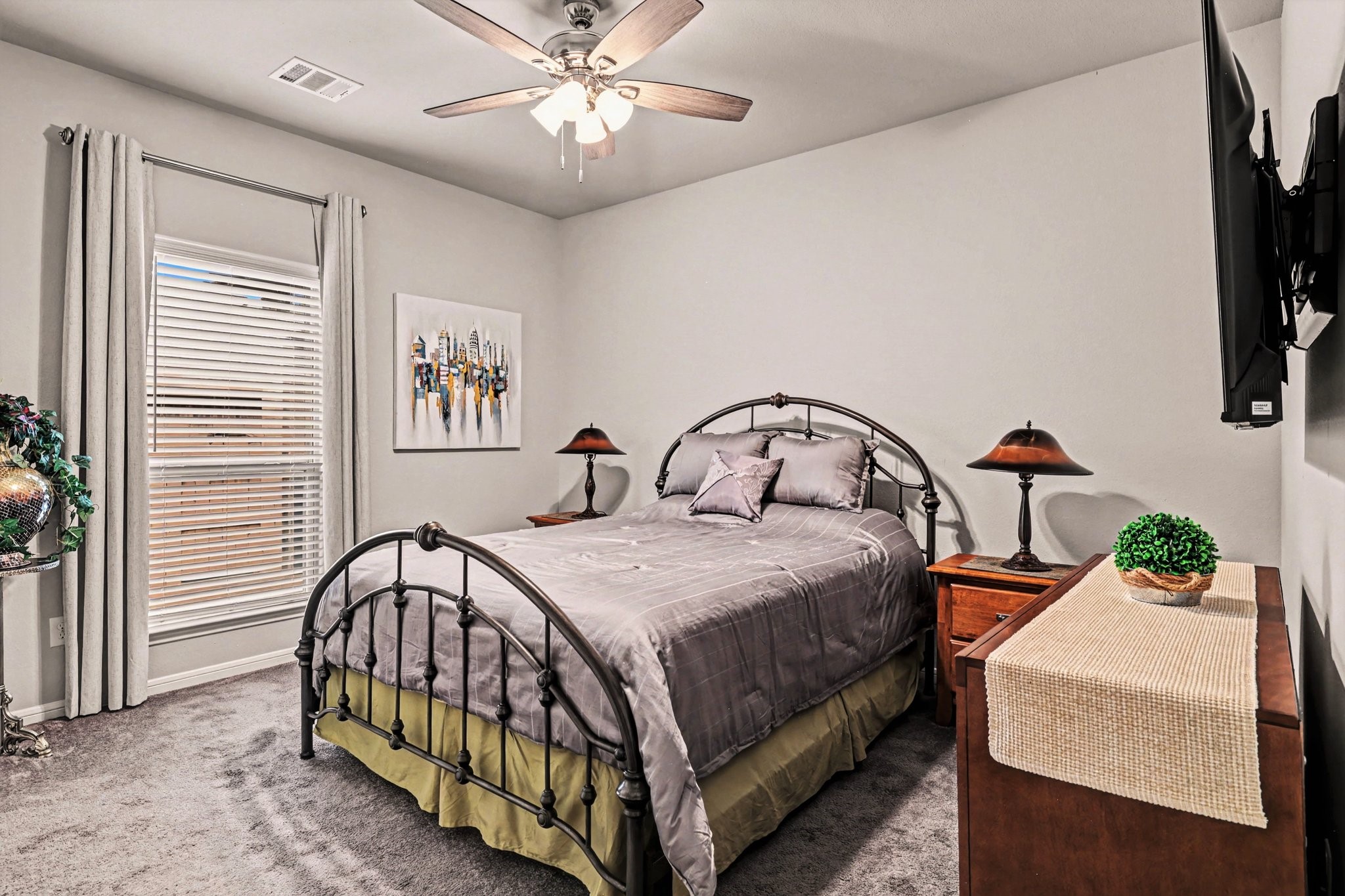 320 Red Maple Lane Conroe, TX 77304 - Photo 17 of 27 a bedroom with a bed and a chandelier