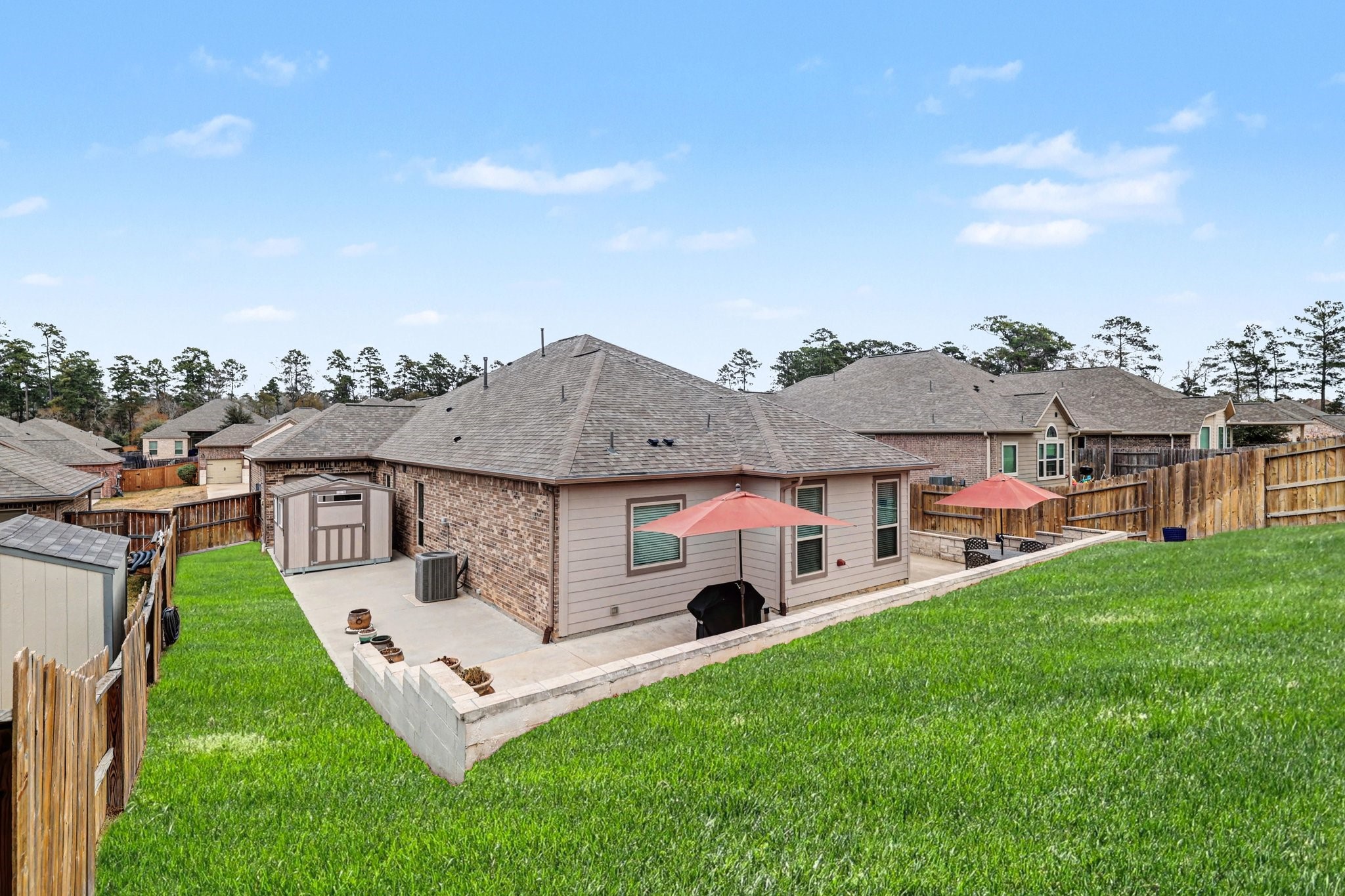 320 Red Maple Lane Conroe, TX 77304 - Photo 22 of 27 a aerial view of a house with a yard