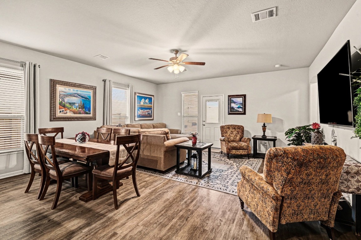 320 Red Maple Lane Conroe, TX 77304 - Photo 27 of 27 a living room with furniture a flat screen tv and kitchen view