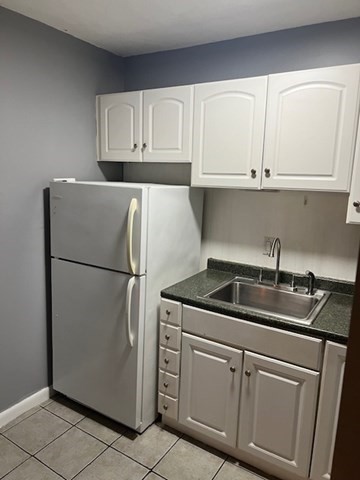 110 Boston Post Road East, Unit 4 Marlborough, MA 01752 - Photo 2 of 13 a kitchen with appliances and cabinets