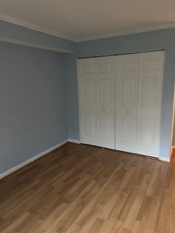 110 Boston Post Road East, Unit 4 Marlborough, MA 01752 - Photo 5 of 13 a view of an empty room with wooden floor