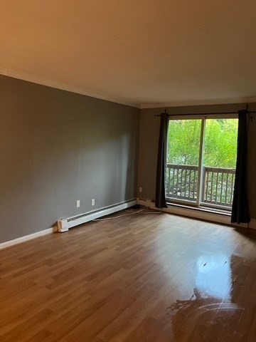 110 Boston Post Road East, Unit 4 Marlborough, MA 01752 - Photo 10 of 13 a view of an empty room with a window