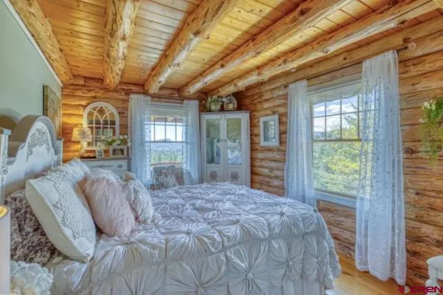 a view of a dining room with furniture and a window