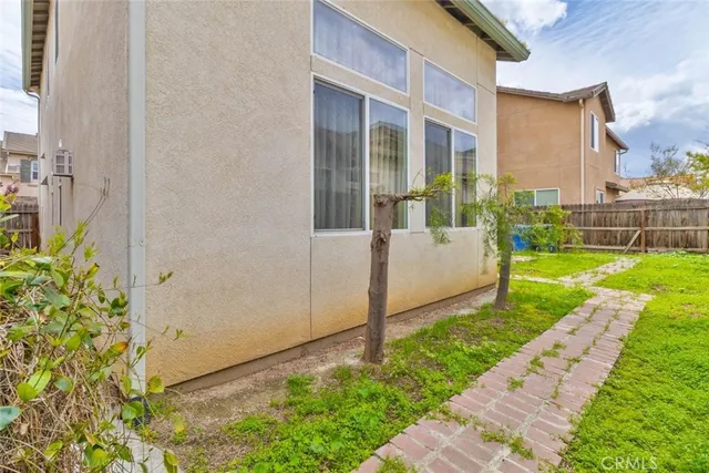 a view of a patio with table and chairs and potted plants