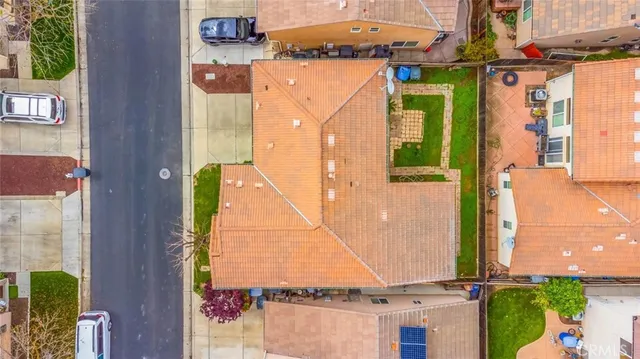an aerial view of a house with a swimming pool