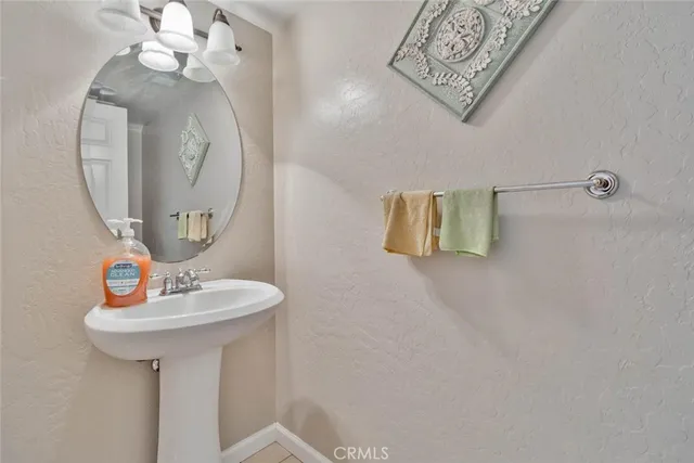 a bathroom with a sink and mirror