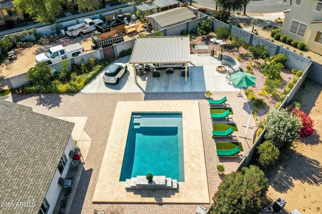an aerial view of residential houses with outdoor space