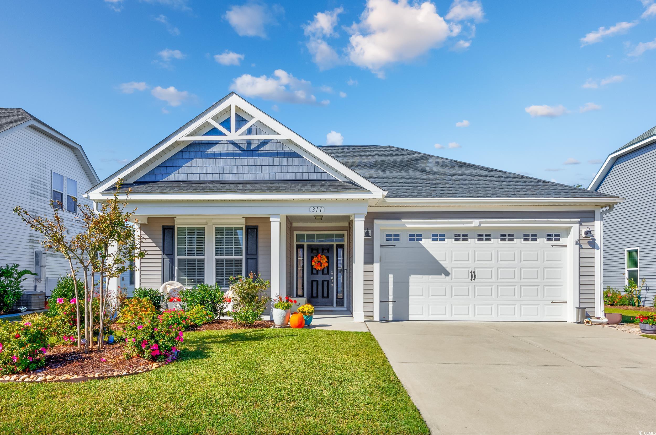 311 Switchgrass Loop Little River, SC 29566 - Photo 2 of 38 View of front of house featuring a front lawn and