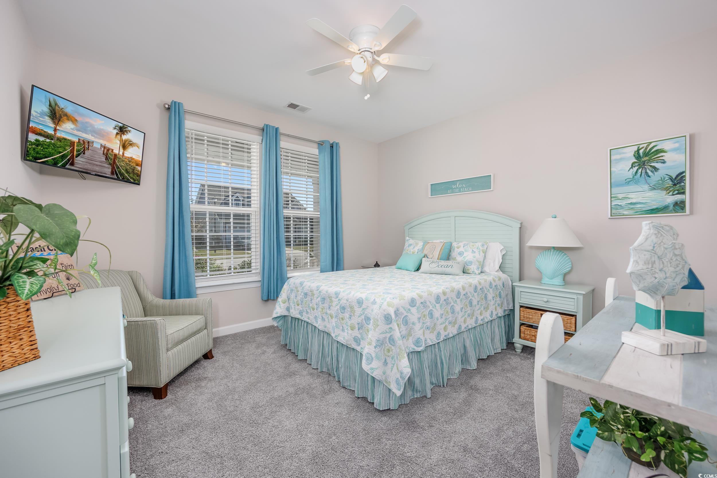 311 Switchgrass Loop Little River, SC 29566 - Photo 21 of 38 Carpeted bedroom with ceiling fan