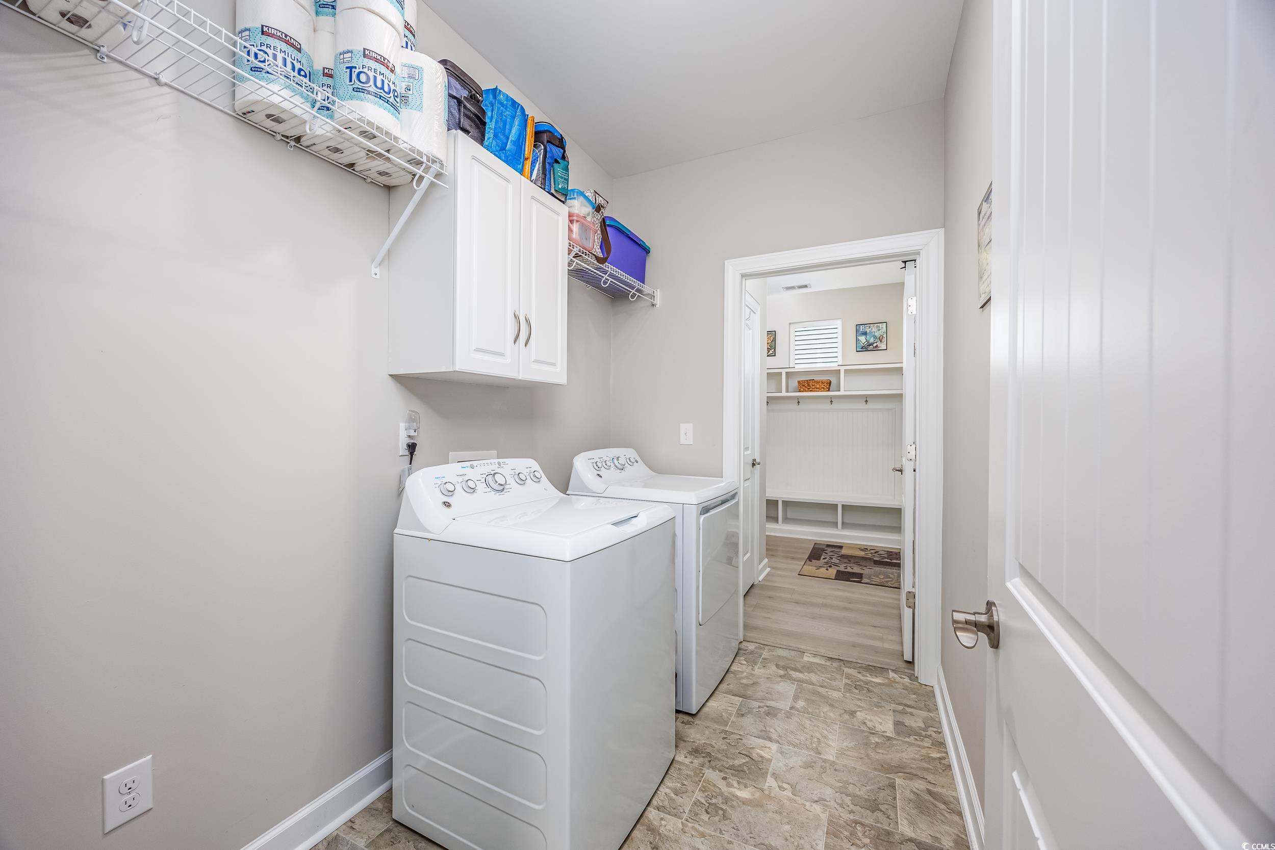 311 Switchgrass Loop Little River, SC 29566 - Photo 23 of 38 Washroom featuring washer and dryer and cabinets