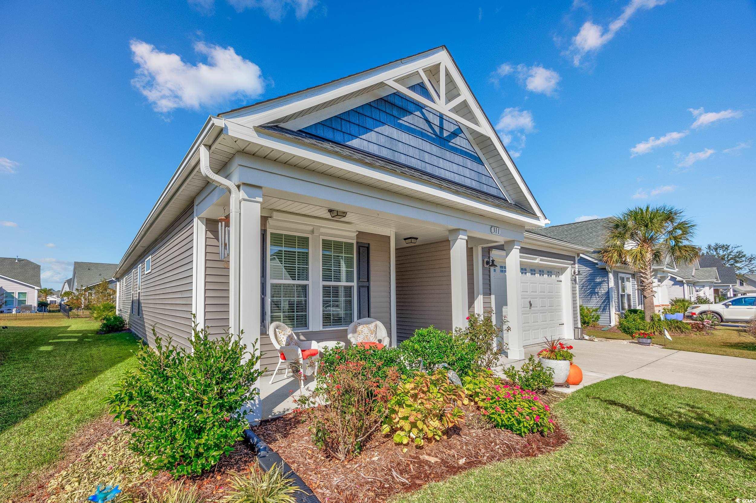 311 Switchgrass Loop Little River, SC 29566 - Photo 4 of 38 View of front facade featuring a front yard, a por