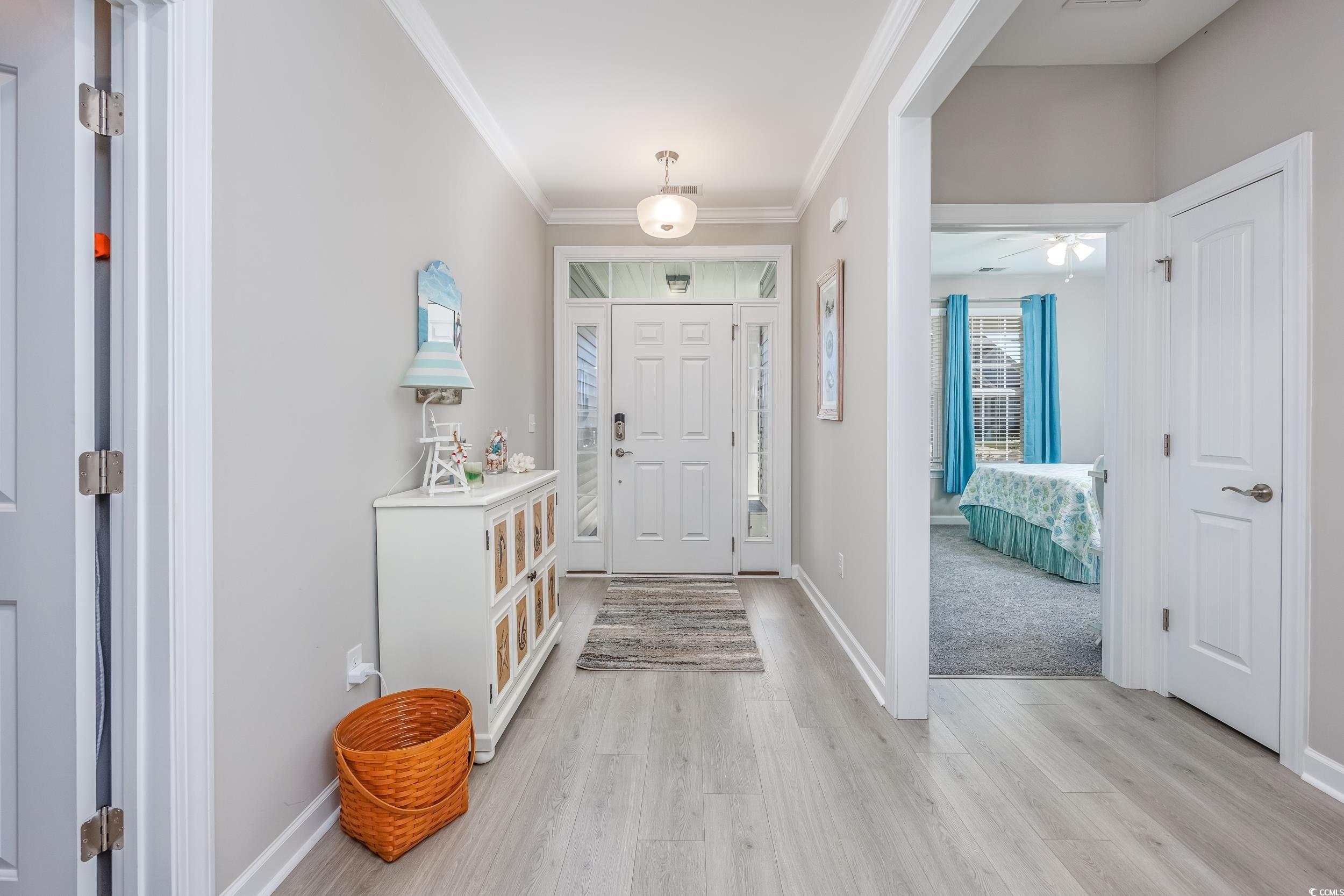 311 Switchgrass Loop Little River, SC 29566 - Photo 6 of 38 Foyer featuring light hardwood / wood-style floors