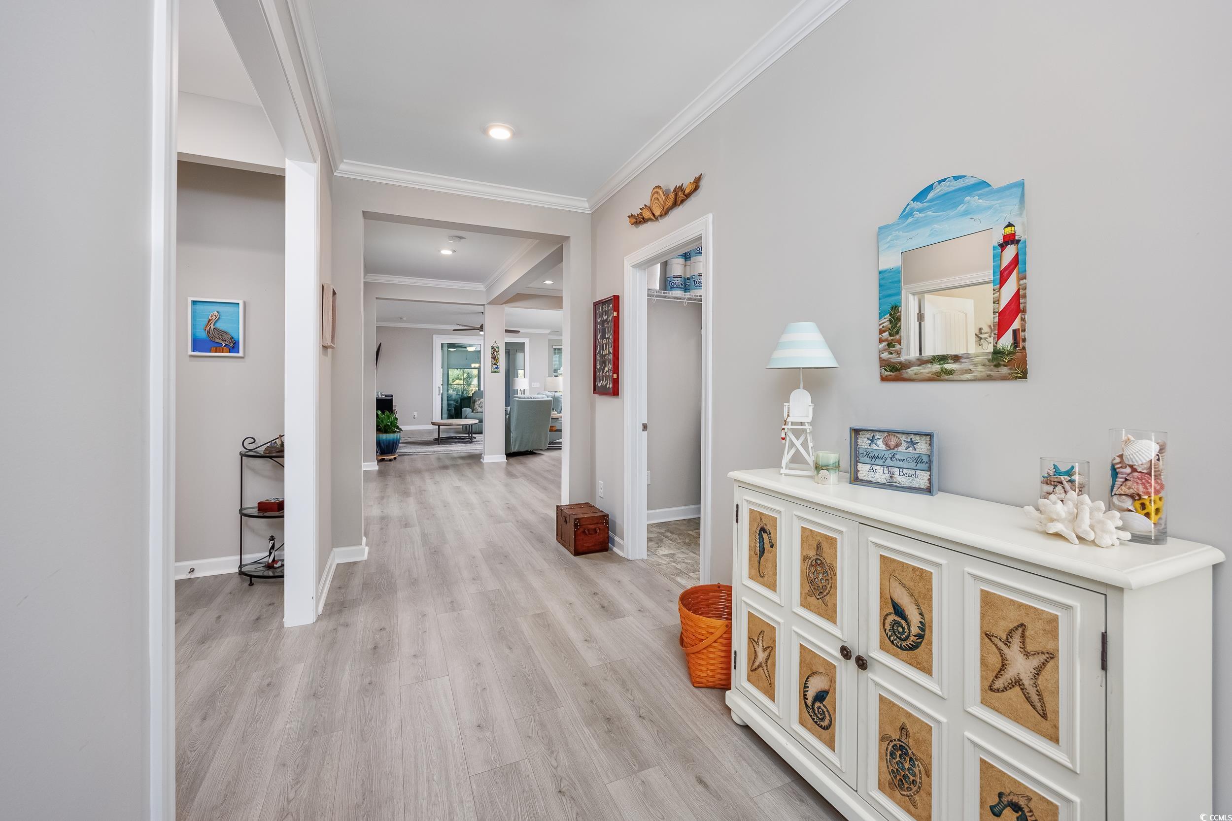 311 Switchgrass Loop Little River, SC 29566 - Photo 7 of 38 Corridor featuring ornamental molding and light wo