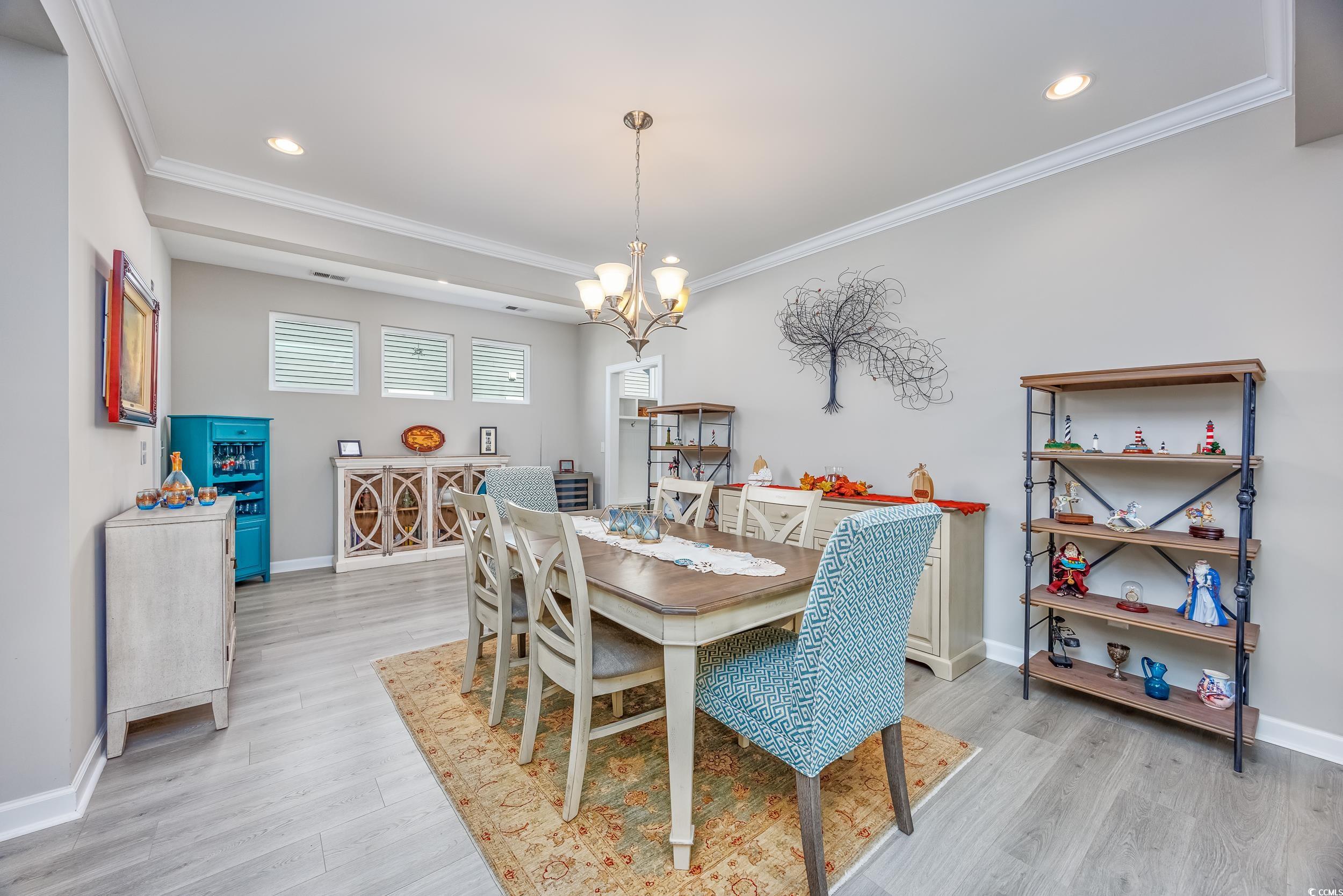 311 Switchgrass Loop Little River, SC 29566 - Photo 8 of 38 Dining room with ornamental molding, an inviting c