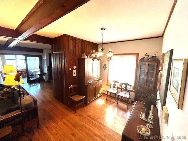 a view of a livingroom with furniture and a window