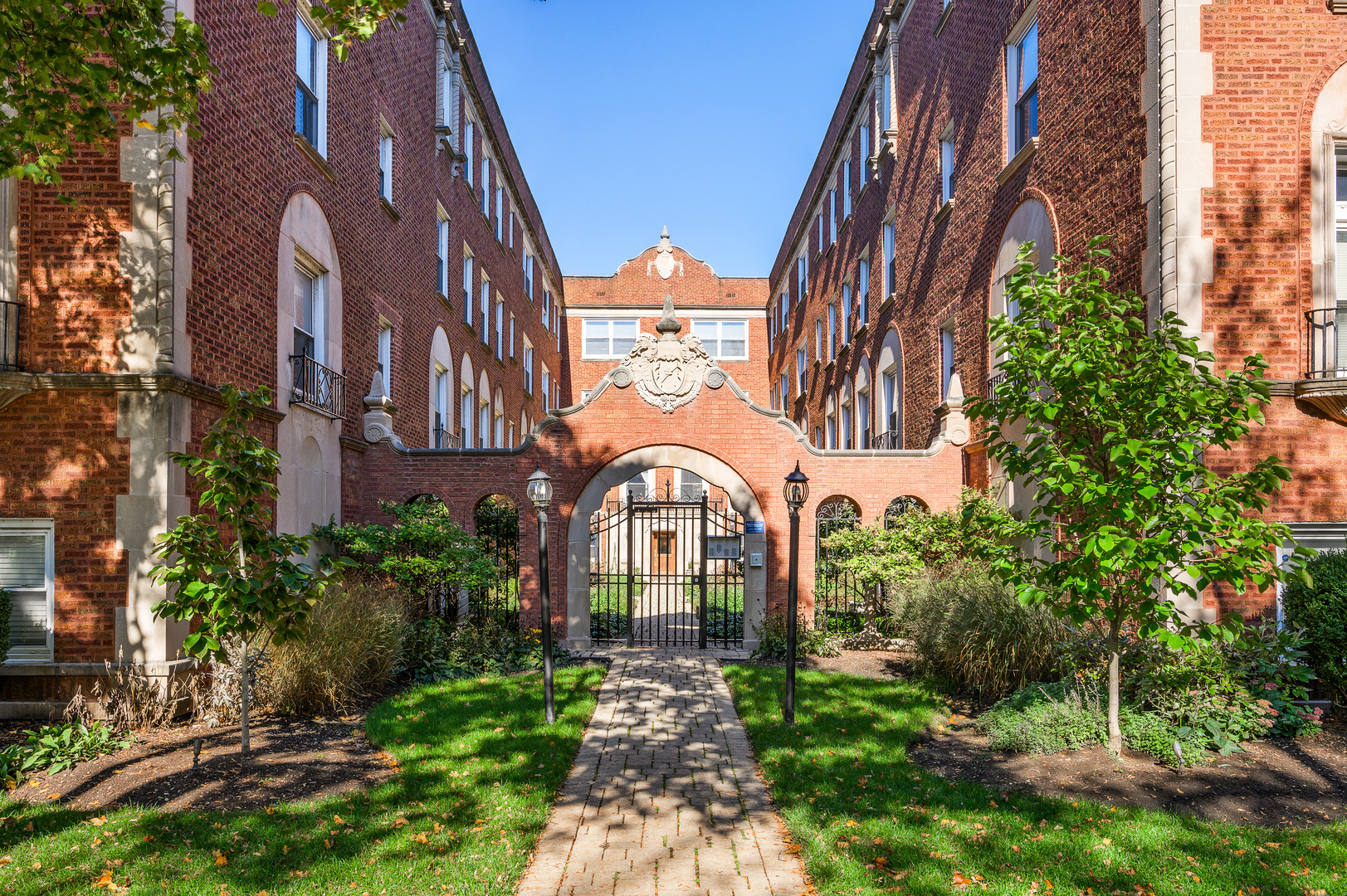 1544 West Sherwin Avenue, Unit 2N Chicago, IL 60626 - Photo 1 of 19 a view of a brick house with a clock tower in the middle
