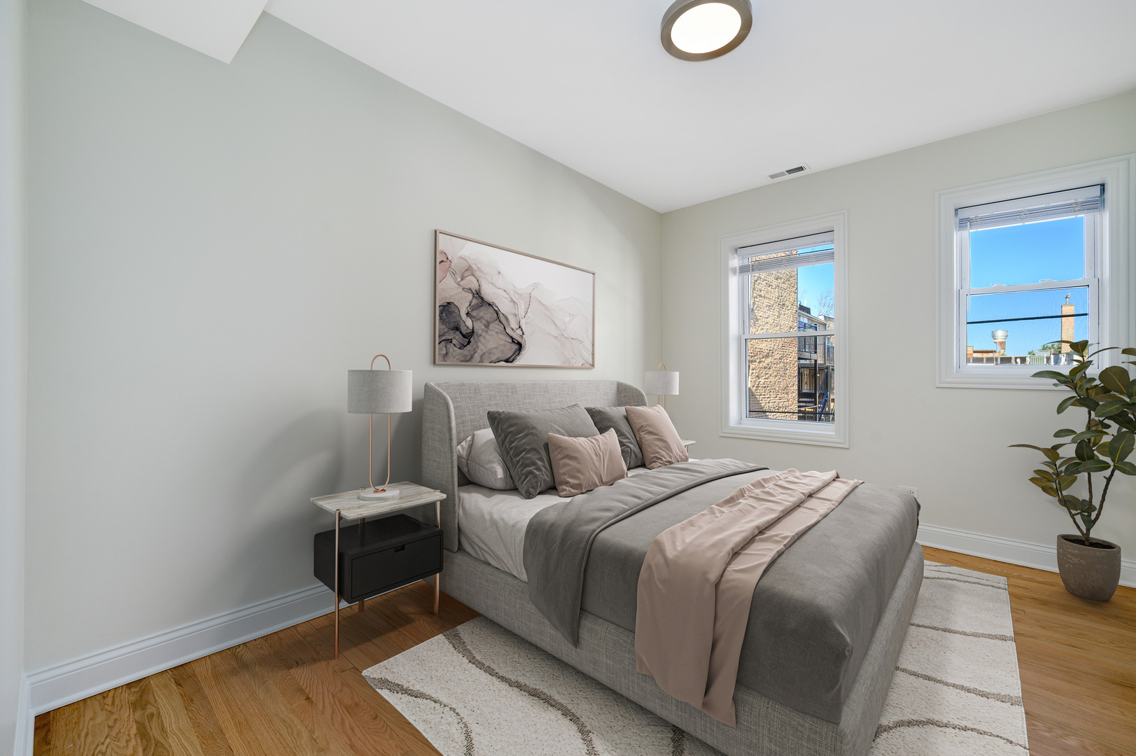 1544 West Sherwin Avenue, Unit 2N Chicago, IL 60626 - Photo 12 of 19 a bedroom with a bed and potted plant