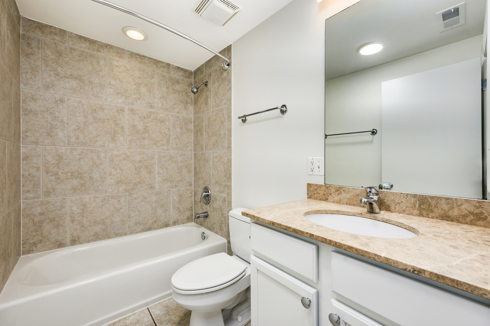 1544 West Sherwin Avenue, Unit 2N Chicago, IL 60626 - Photo 13 of 19 a bathroom with a granite countertop sink a toilet and shower
