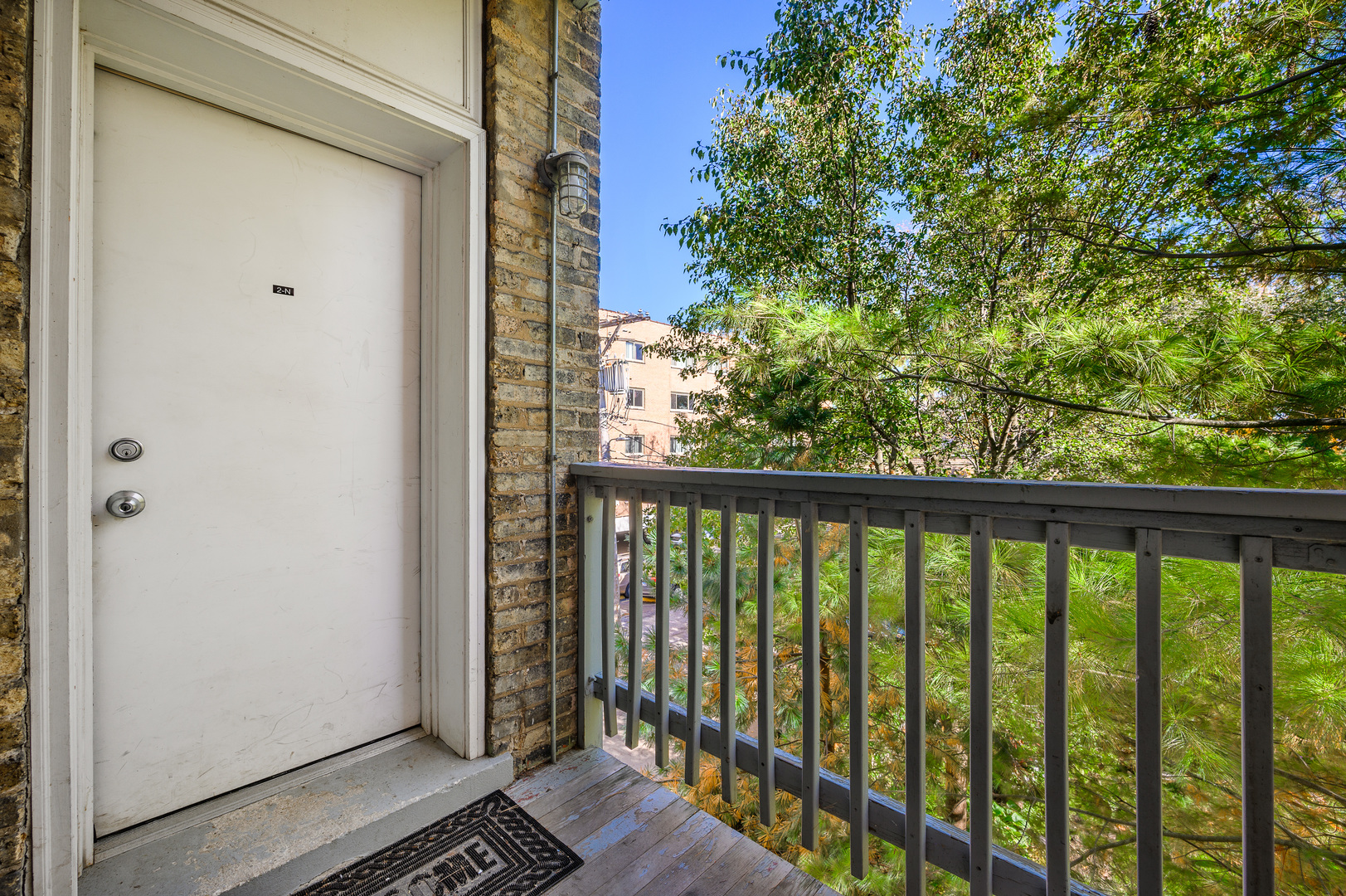 1544 West Sherwin Avenue, Unit 2N Chicago, IL 60626 - Photo 14 of 19 a view of a balcony with wooden floor