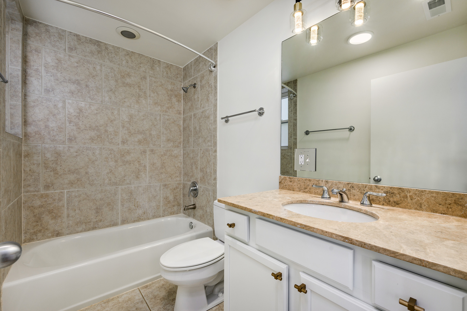 1544 West Sherwin Avenue, Unit 2N Chicago, IL 60626 - Photo 10 of 19 a bathroom with a granite countertop sink a toilet and shower