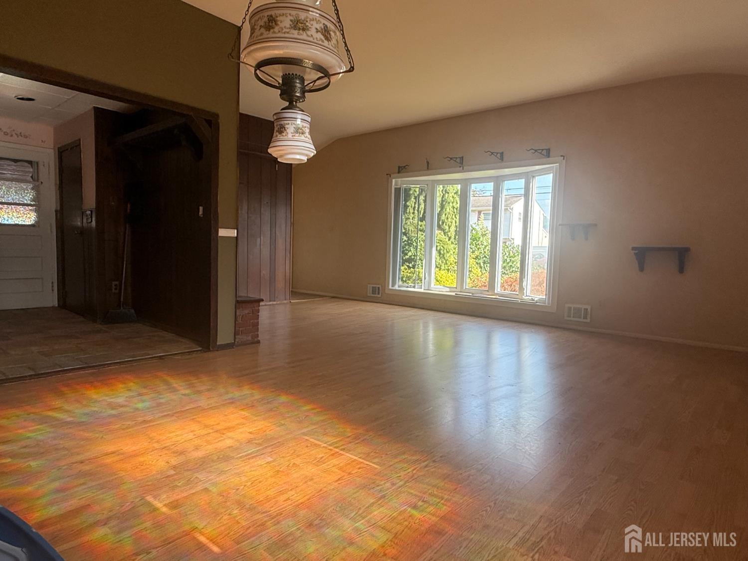 42 Boulevard East Old Bridge, NJ 07735 - Photo 5 of 14 a view of a livingroom with wooden floor and a window