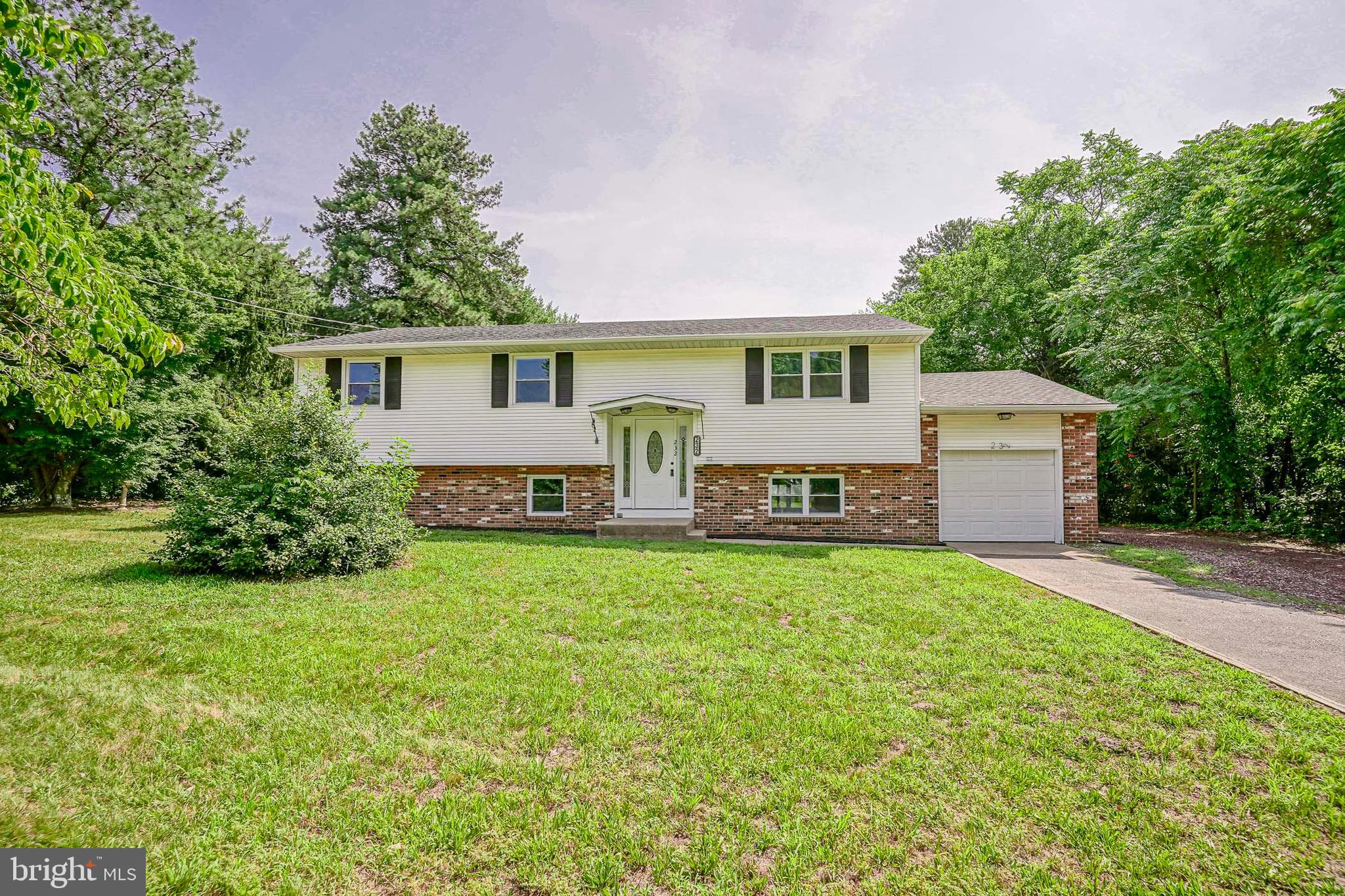 a house view with a garden space