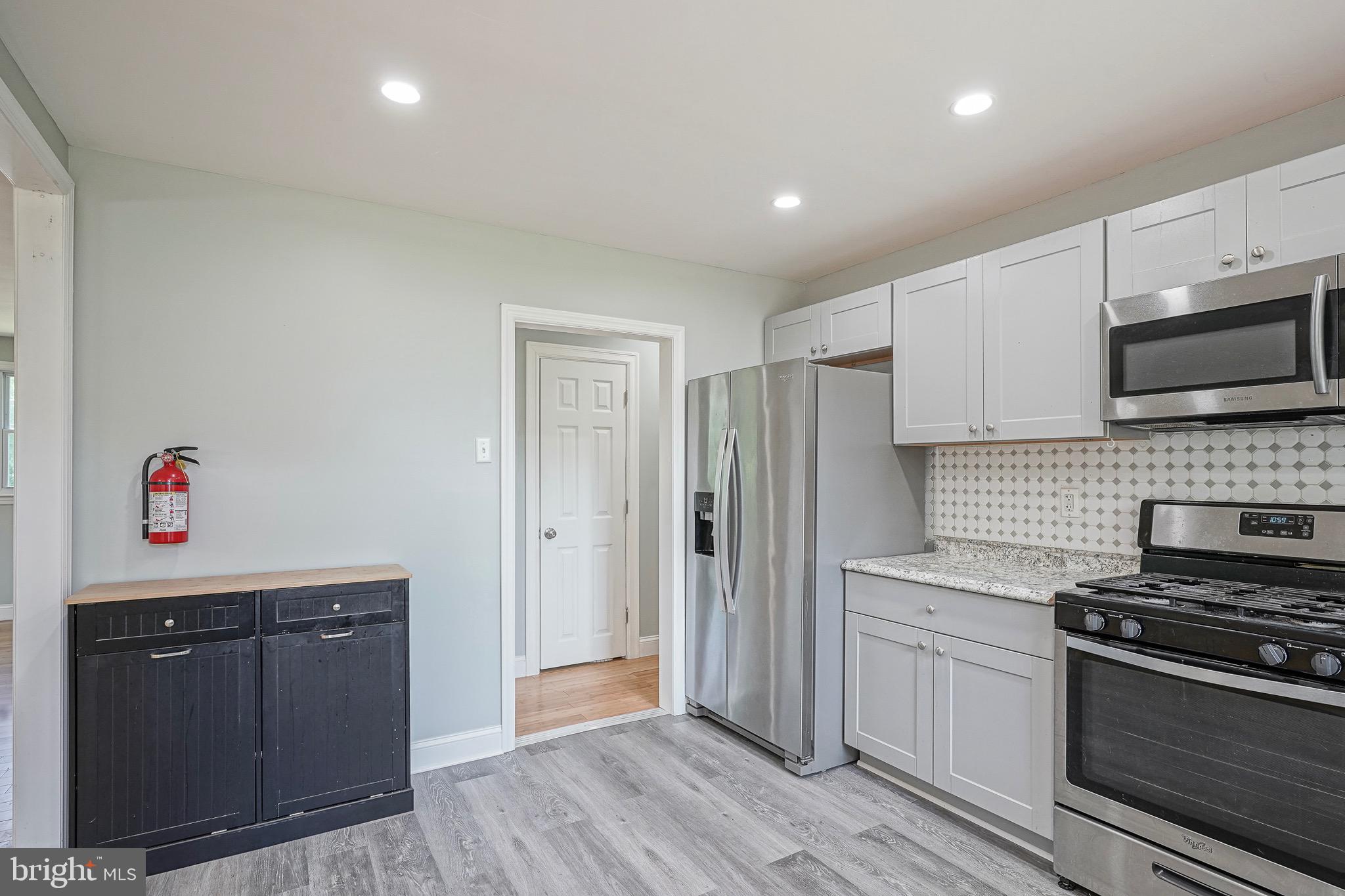232 Egg Harbor Road Sewell, NJ 08080 - Photo 12 of 36 a kitchen with stainless steel appliances a refrigerator stove and microwave