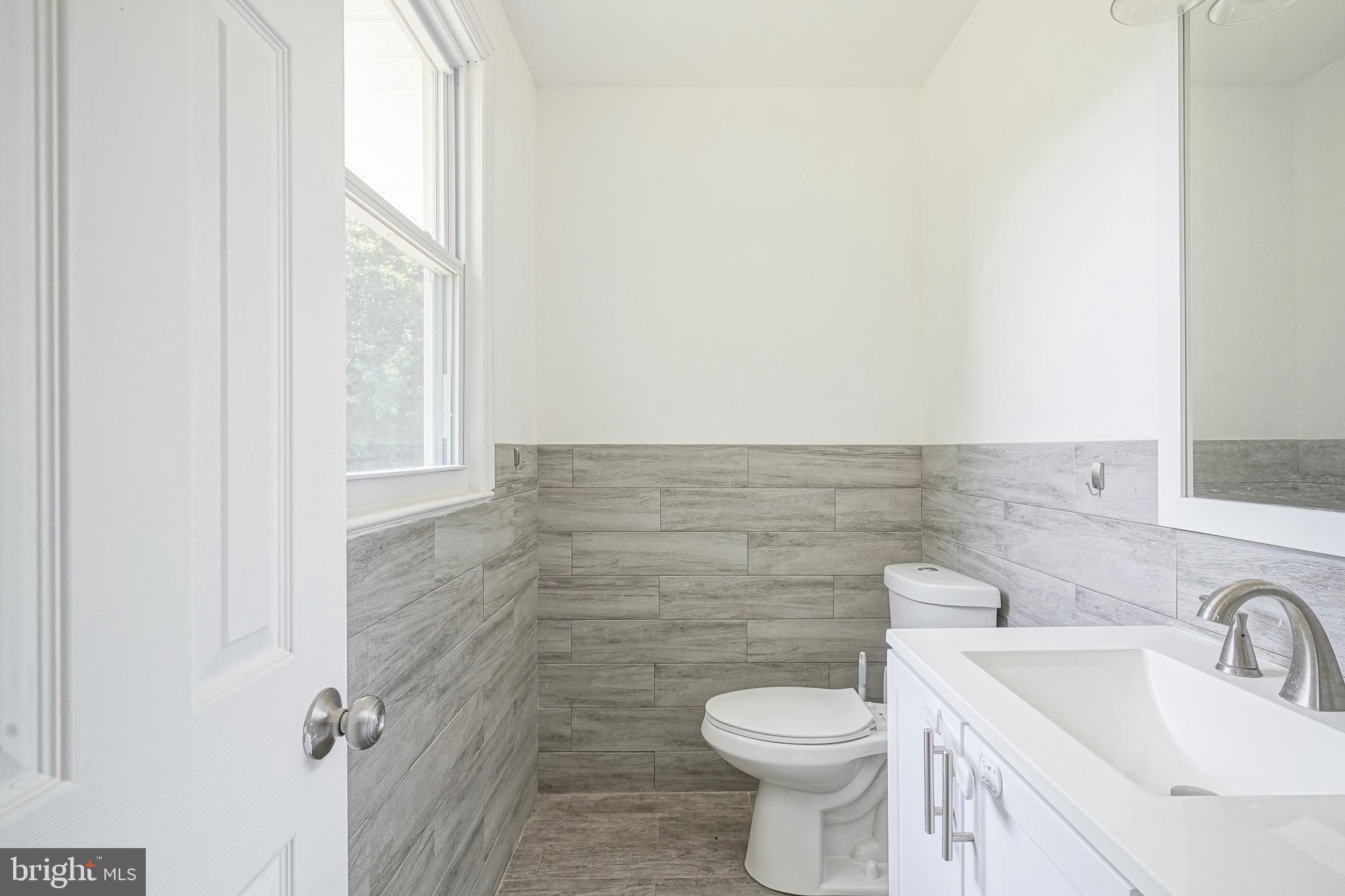 232 Egg Harbor Road Sewell, NJ 08080 - Photo 21 of 36 a bathroom with a sink a toilet and a mirror