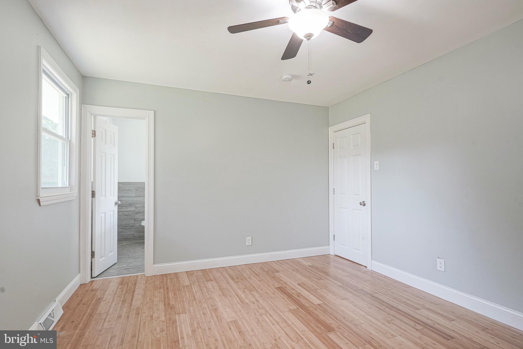 232 Egg Harbor Road Sewell, NJ 08080 - Photo 23 of 36 an empty room with wooden floor and windows