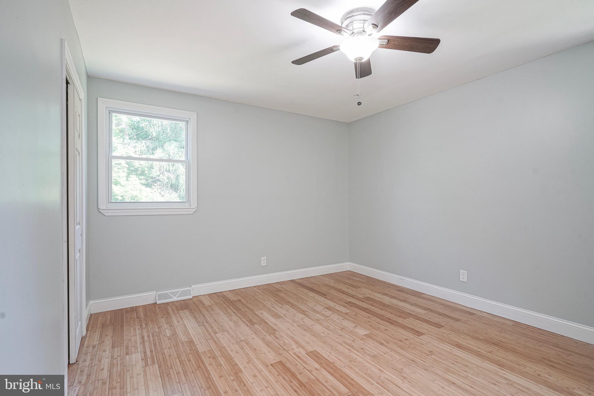 232 Egg Harbor Road Sewell, NJ 08080 - Photo 24 of 36 wooden floor in an empty room with a window