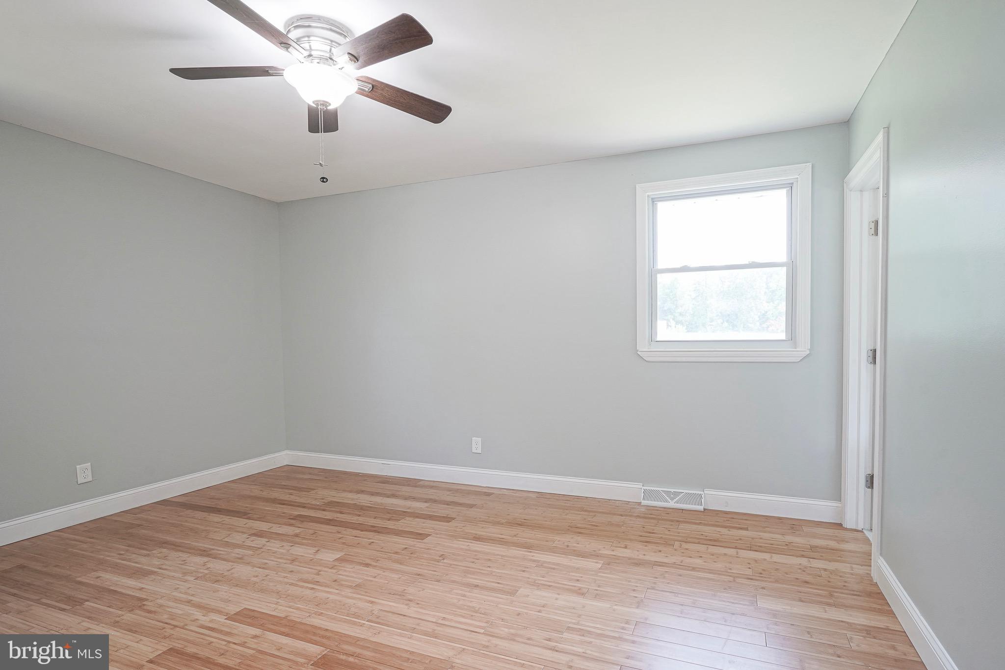 232 Egg Harbor Road Sewell, NJ 08080 - Photo 25 of 36 an empty room with a window and a fan