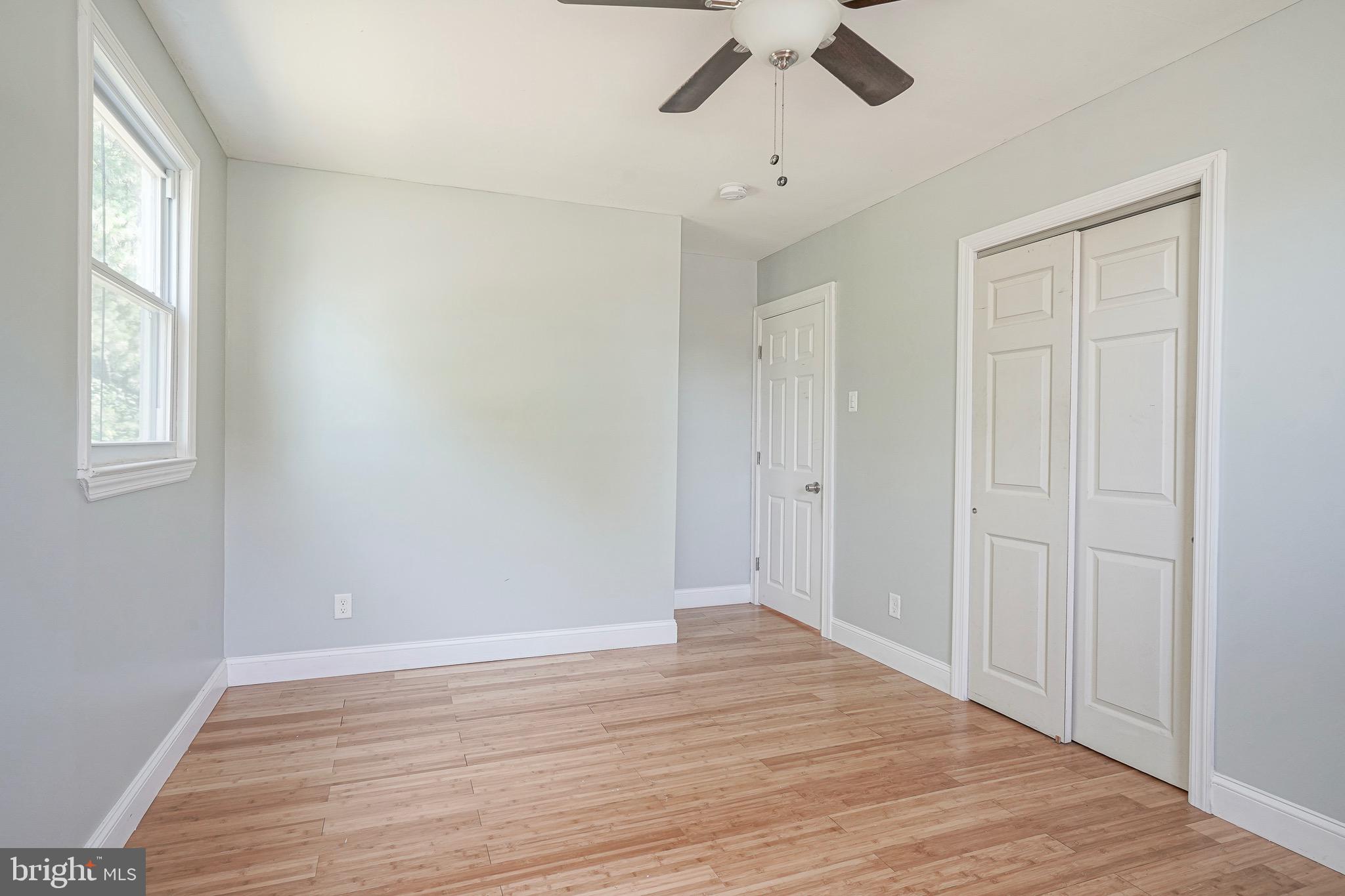 232 Egg Harbor Road Sewell, NJ 08080 - Photo 27 of 36 wooden floor in an empty room with a window