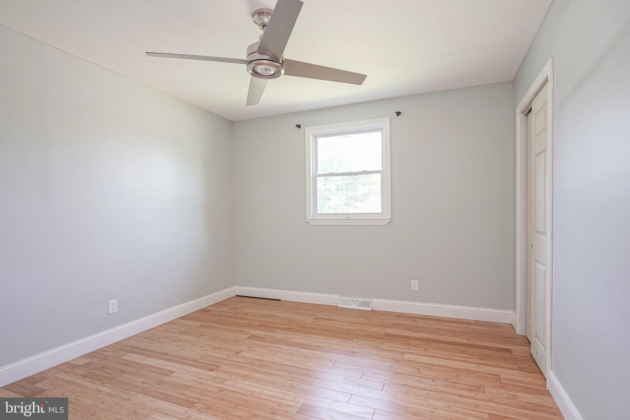 232 Egg Harbor Road Sewell, NJ 08080 - Photo 32 of 36 a view of an empty room with wooden floor and a window