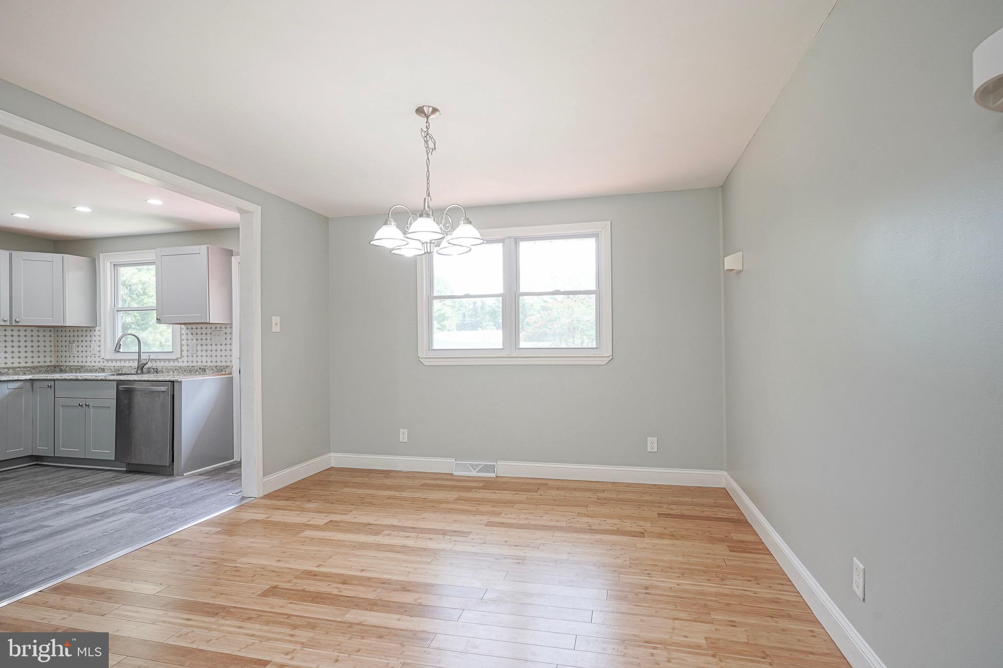 232 Egg Harbor Road Sewell, NJ 08080 - Photo 6 of 36 a view of a kitchen with a dishwasher cabinets and wooden floor