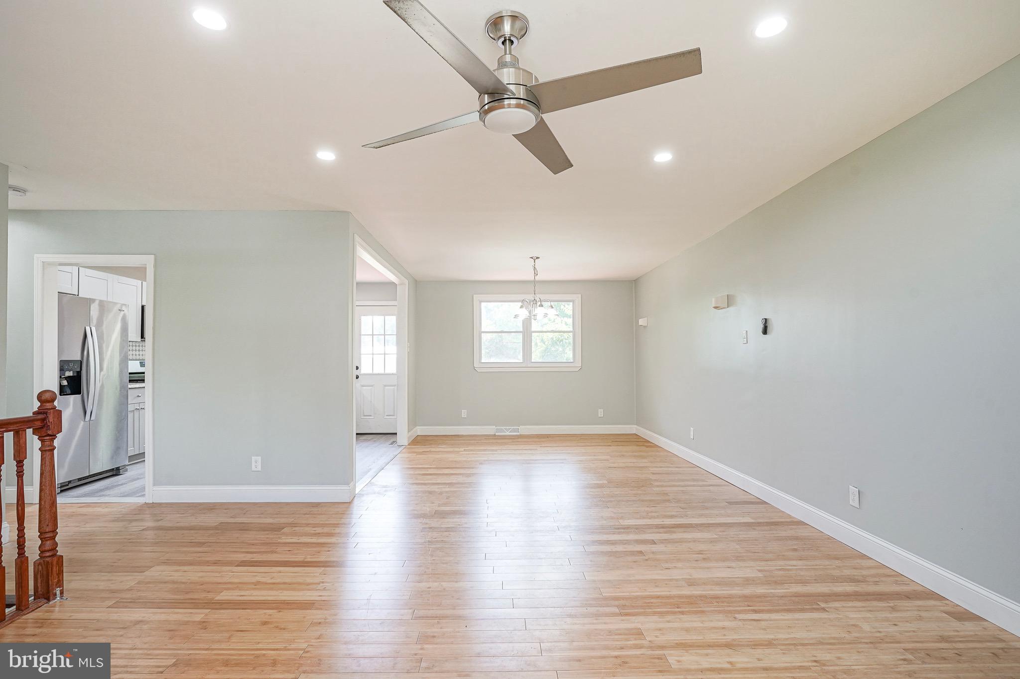 232 Egg Harbor Road Sewell, NJ 08080 - Photo 7 of 36 a view of an empty room with window and wooden floor