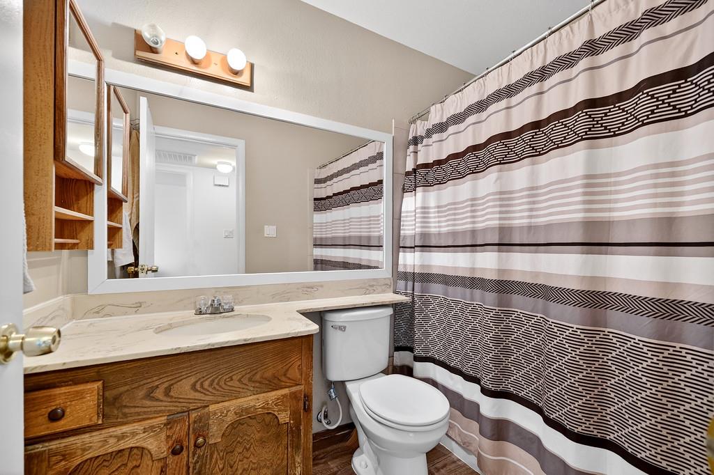 1052 Clinton Road Sacramento, CA 95825 - Photo 18 of 52 a bathroom with a sink a toilet and shower