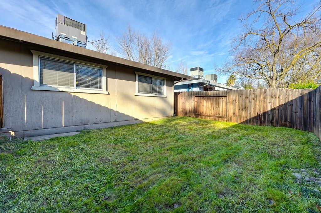 1052 Clinton Road Sacramento, CA 95825 - Photo 23 of 52 a backyard of a house with lots of green space