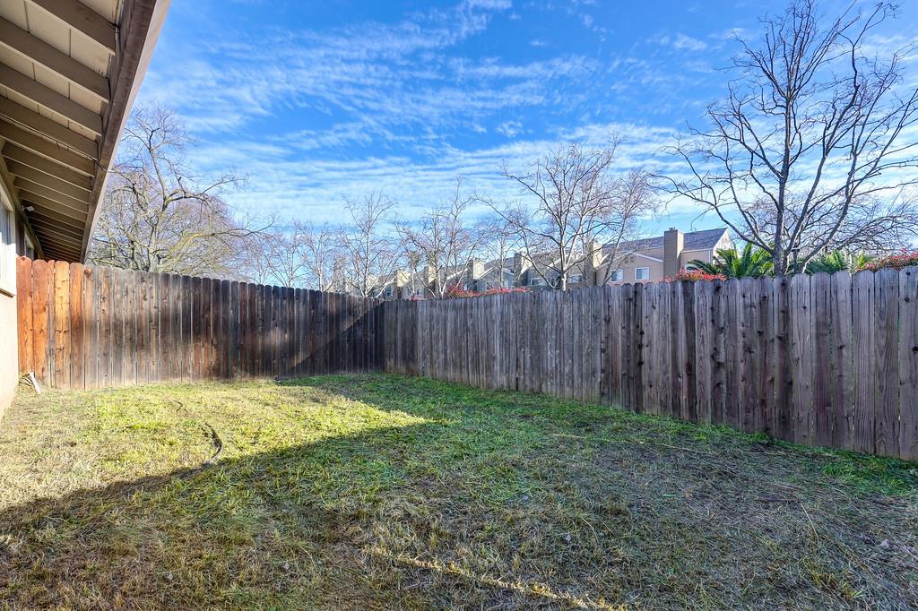 1052 Clinton Road Sacramento, CA 95825 - Photo 49 of 52 a view of backyard with tree