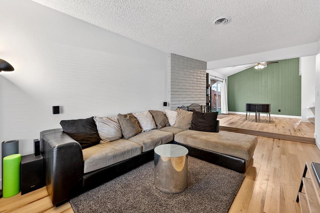 1052 Clinton Road Sacramento, CA 95825 - Photo 7 of 52 a living room with furniture and a wooden floor