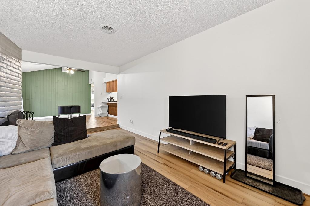 1052 Clinton Road Sacramento, CA 95825 - Photo 8 of 52 a living room with furniture and a flat screen tv
