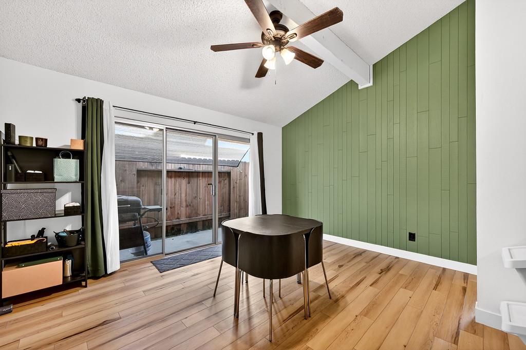 1052 Clinton Road Sacramento, CA 95825 - Photo 10 of 52 a living room with a couch and a wooden floor