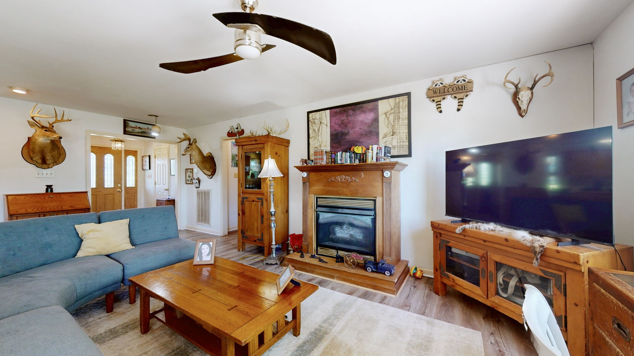 881 Coaling Road Charlotte, TN 37036 - Photo 6 of 29 a living room with furniture and a flat screen tv