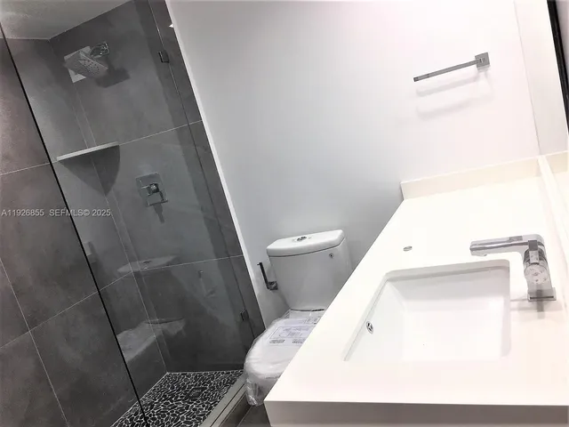 a bathroom with a sink and toilet