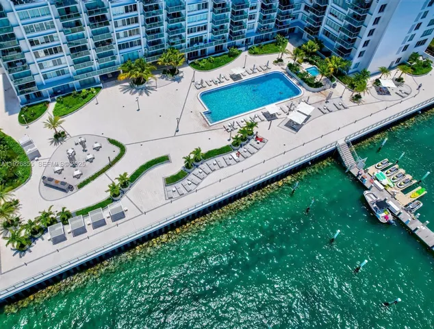 an aerial view of a yard with a table and chairs