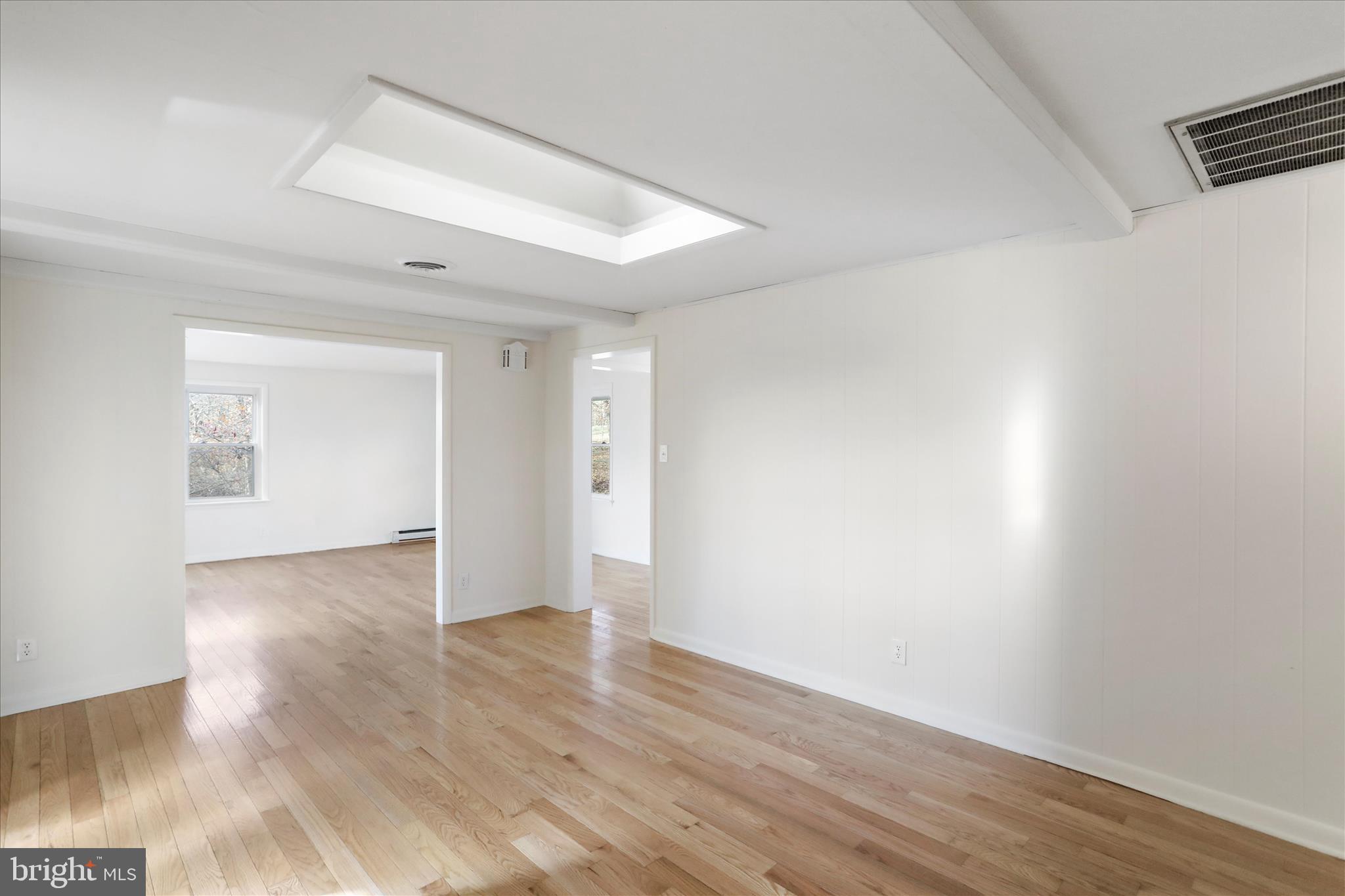 13 Oriole Circle Berkeley Springs, WV 25411 - Photo 16 of 36 wooden floor in an empty room