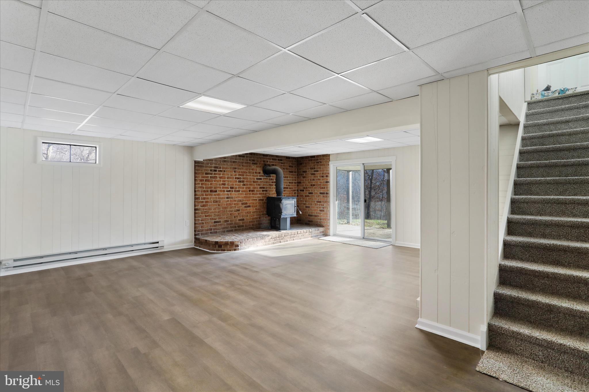 13 Oriole Circle Berkeley Springs, WV 25411 - Photo 27 of 36 an empty room with wooden floor and windows