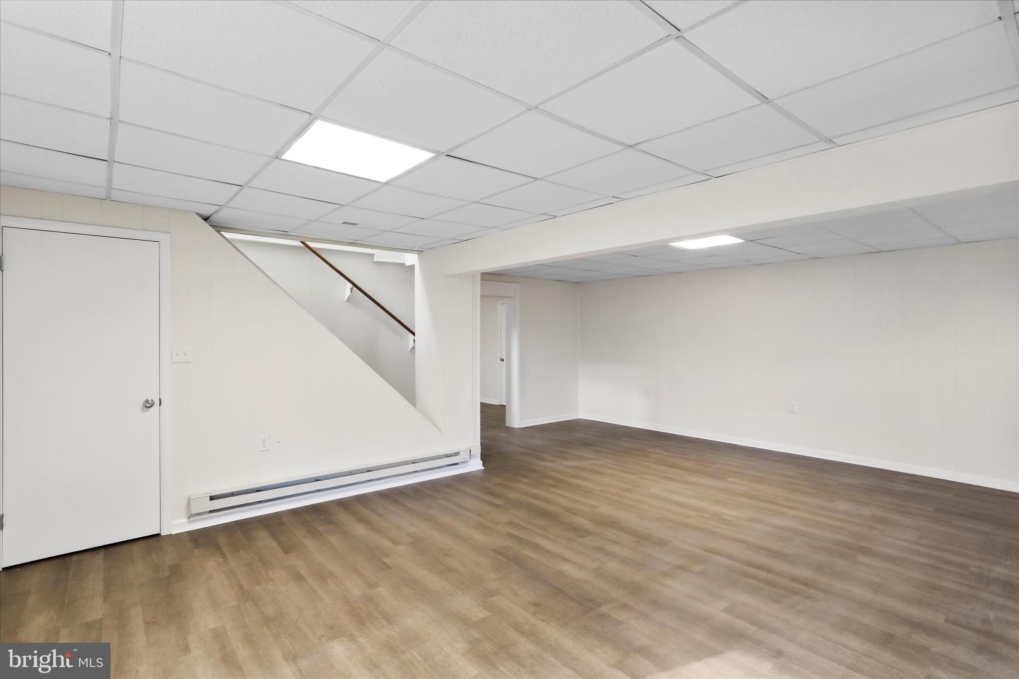 13 Oriole Circle Berkeley Springs, WV 25411 - Photo 28 of 36 an empty room with wooden floor and white walls